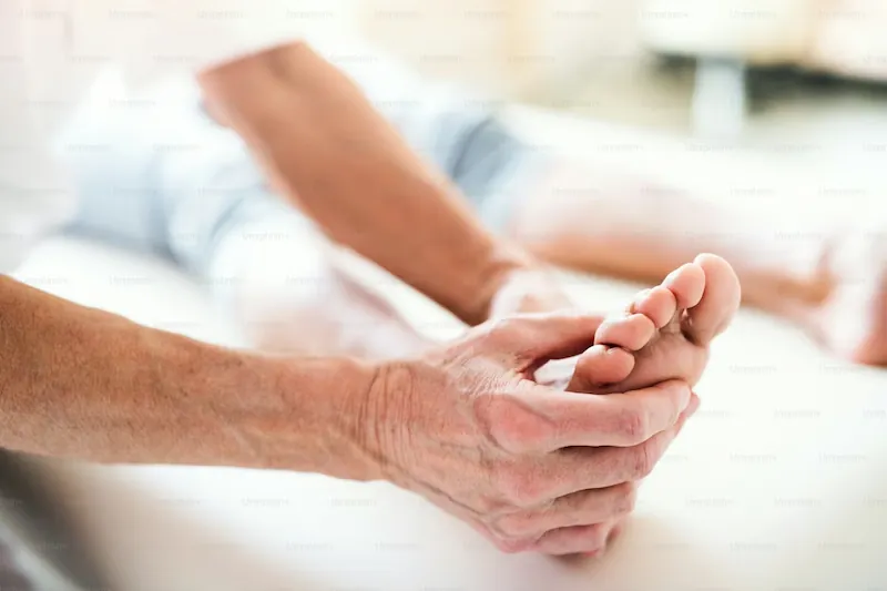 A clinical foot examination being performed to determine the underlying cause of peripheral neuropathy.